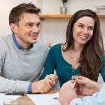 Young couple meeting financial advisor for investment