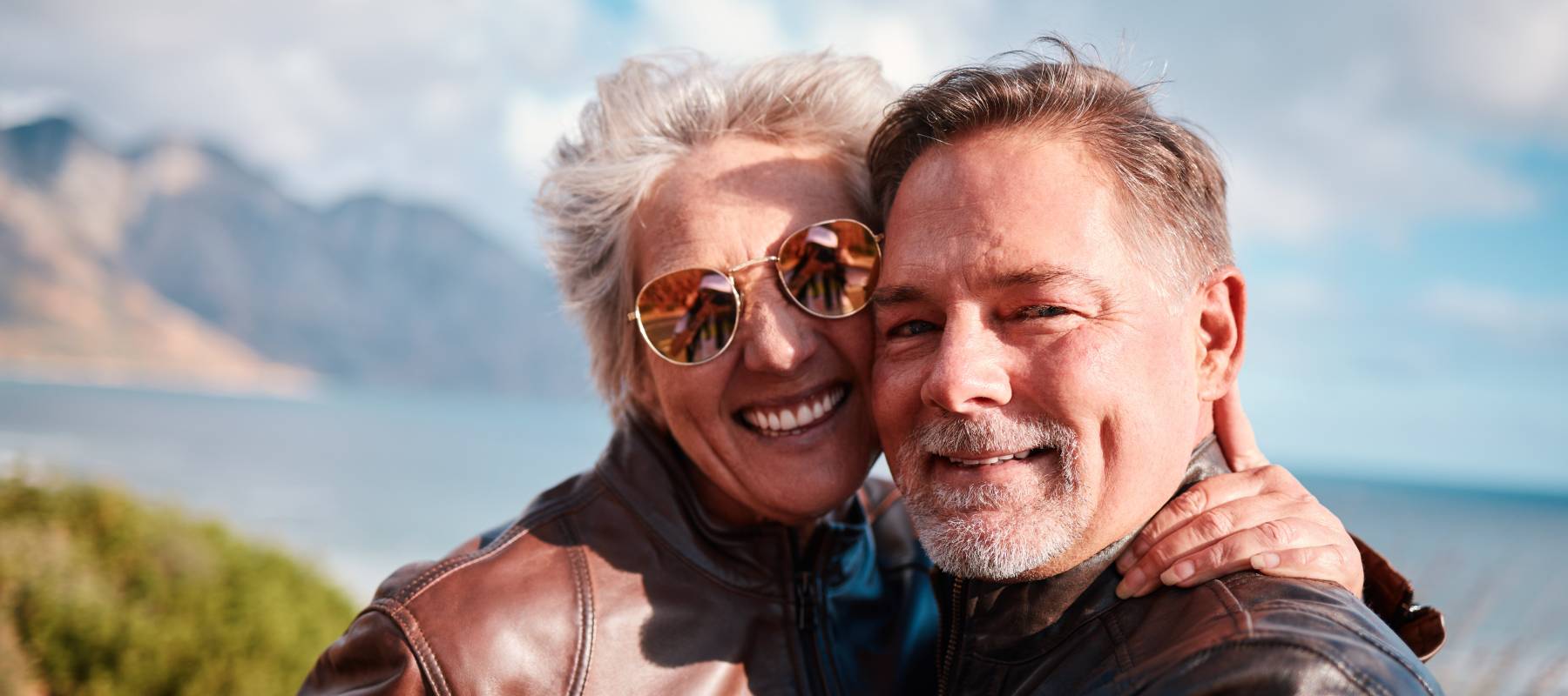 portrait of senior couple enjoying holiday, adventure and vacation in countryside,