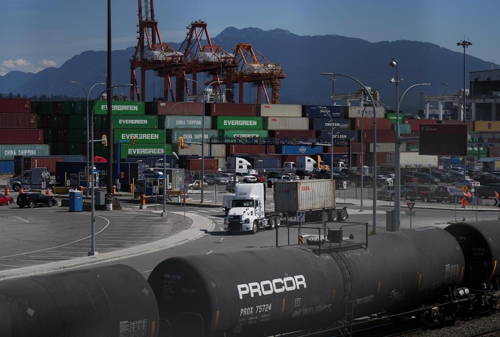 The Vancouver Fraser Port Authority says a record cargo volume rolled through its terminals last year, despite a sputtering global economy and a big drop in container shipments. Transport tru