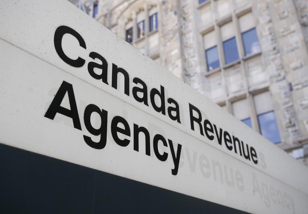 A sign outside the Canada Revenue Agency is seen Monday May 10, 2021 in Ottawa. The Canada Revenue Agency has now fired more than 200 people for falsely claiming a federal income benefit duri