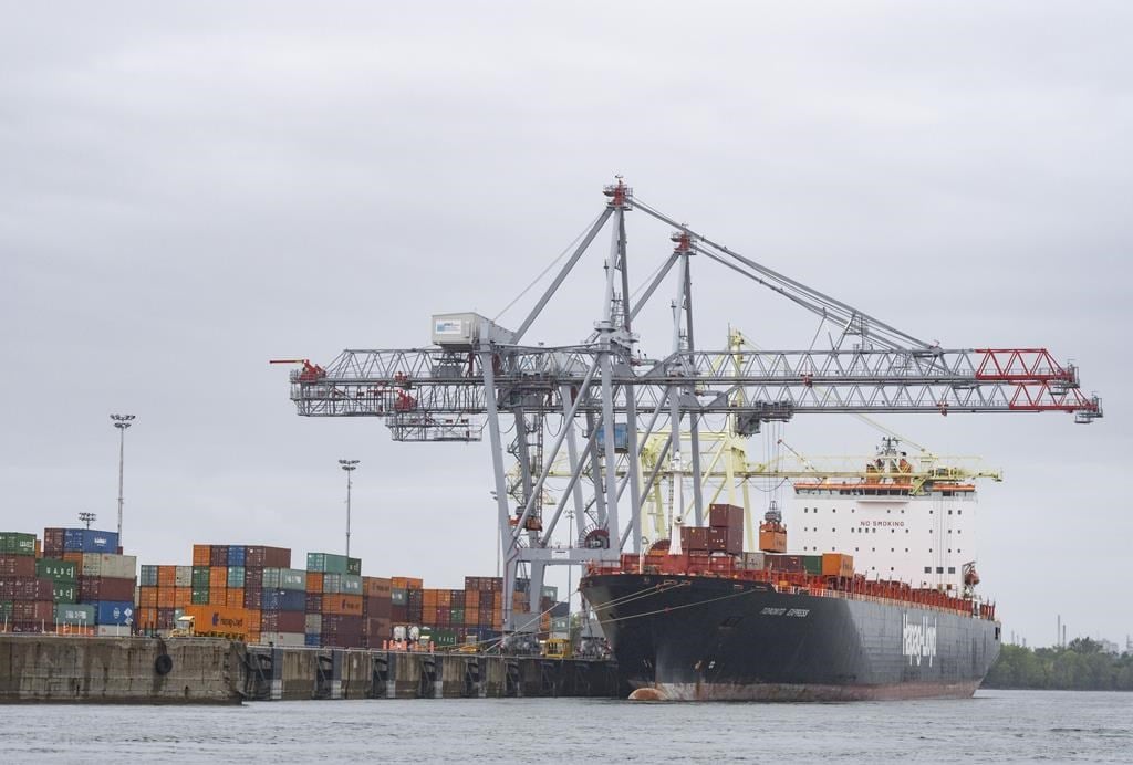 A container ship is loaded in the Port of Montreal, Tuesday, Sept.19, 2023. At least one major transportation company is rerouting cargo away from the Port of Montreal over fears of a potenti