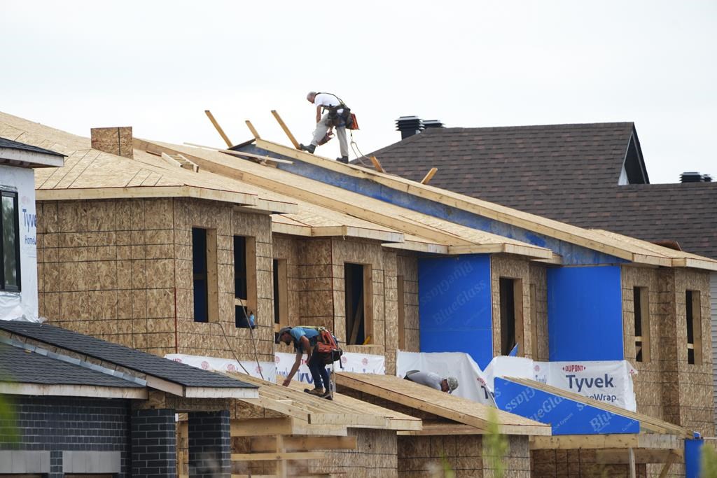 The Canada Mortgage and Housing Corp. is forecasting that real estate prices could match peak levels seen in early 2022 by next year and reach new highs by 2026. New homes are built in Ottawa