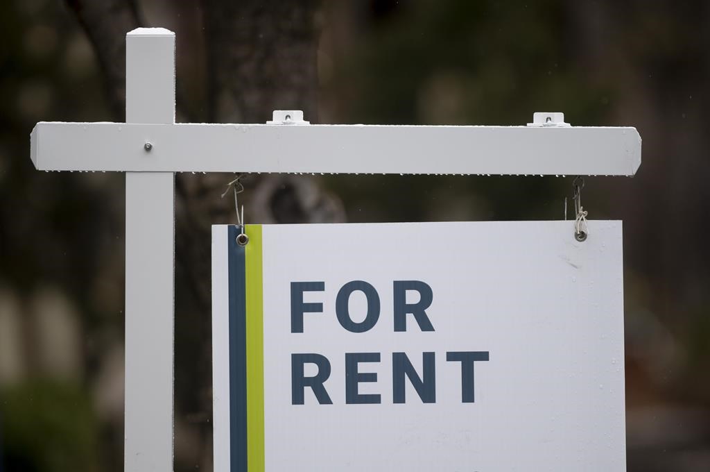 A new report says the asking rent for a home in Canada in March was up 8.8 per cent compared with a year ago, but down from February. A rental sign is seen outside a building in Ottawa, Thurs