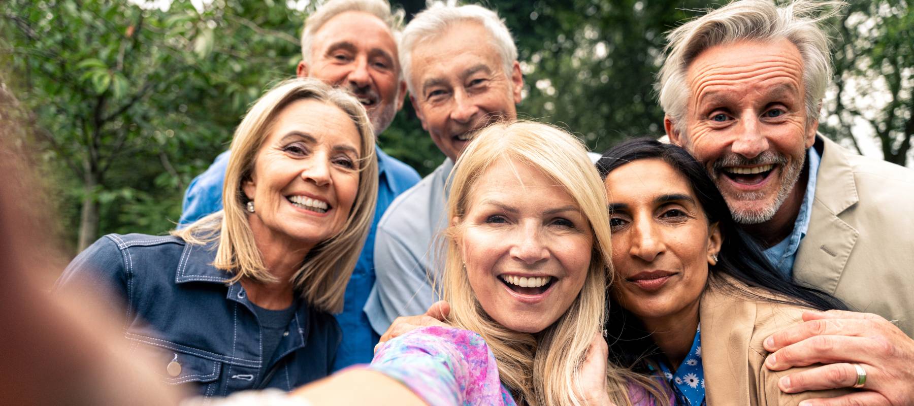 A group of old friends celebrate together.