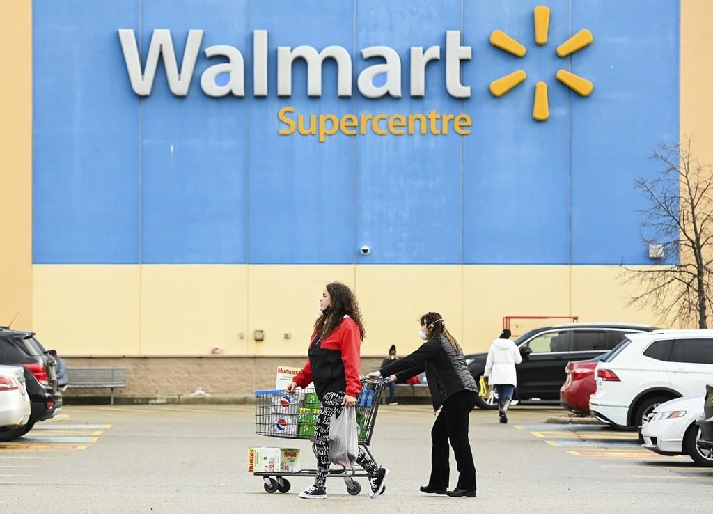Walmart Canada is launching a national pilot program for customers to recycle their reusable shopping bags.People leave a Walmart store in Mississauga, Ont., Thursday, Nov. 26, 2020. 