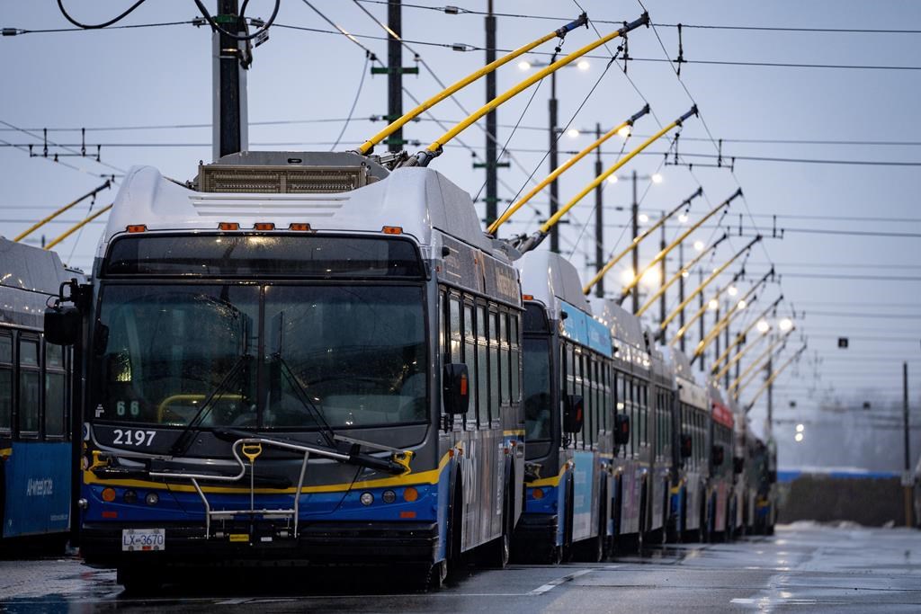 Buses line the Vancouver Transit Centre in Vancouver on Monday, Jan. 22, 2024. British Columbia is earmarking up to $300 million in new capital funding to help TransLink, Metro Vancouver&#039;s tr
