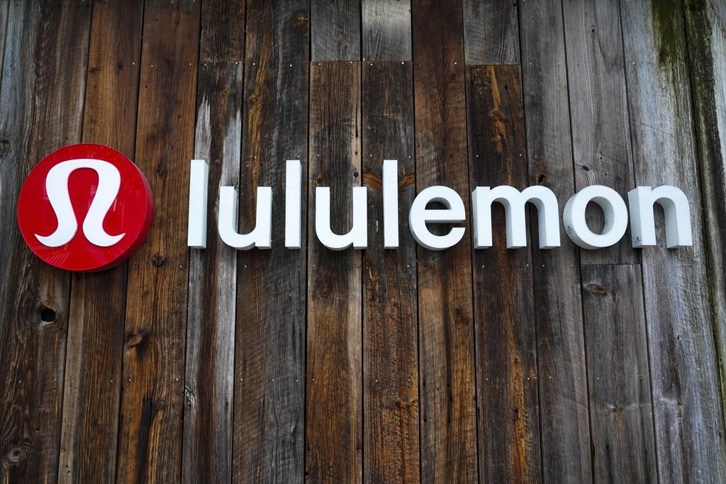 Lululemon Athletica Inc. says it is cutting more than 100 jobs as it plans to close a distribution centre in Washington state. This is the sign on a Lululemon store in Pittsburgh on Wednesday