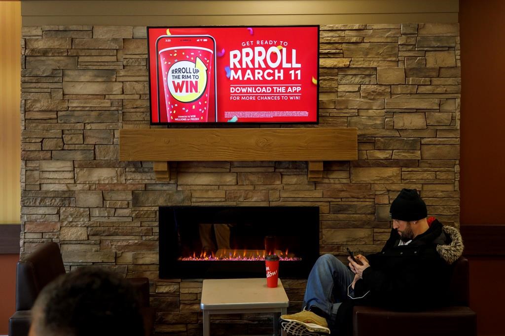 Signage for Tim Hortons&#039; Roll Up the Rim contest is seen inside a Tim Hortons restaurant in Toronto, Friday, March 6, 2020. Tim Hortons says there&#039;s no merit to a proposed class action lawsui