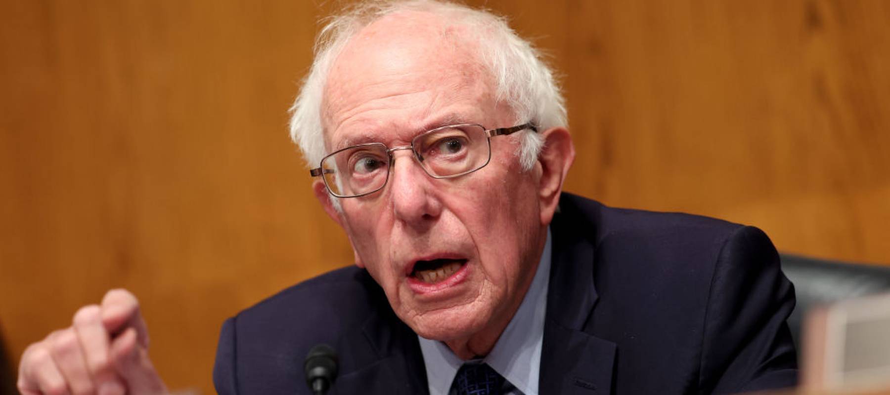 Chairman of the Senate Health, Education, Labor and Pensions Committee Sen. Bernie Sanders seen in a hearing, speaking angrily.