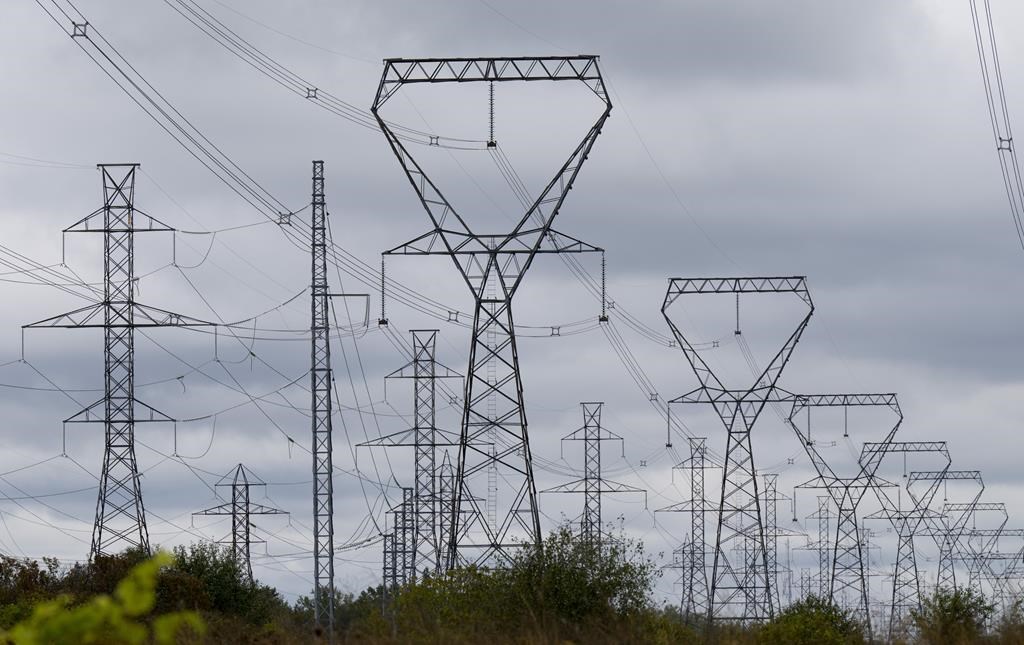 Power lines are seen against cloudy skies near Murvale, Ont., northwest of Kingston, Wednesday, Sept. 7, 2022. For the first time in eight years, Canada imported more electricity from the U.S