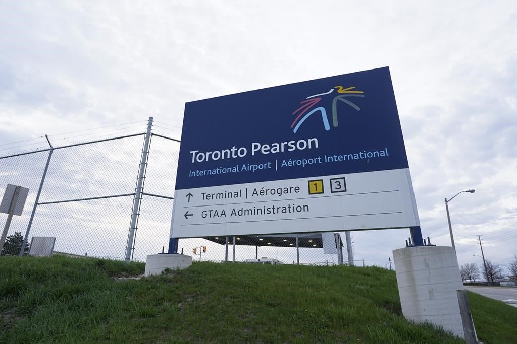 Airline caterer Gate Gourmet says its employees have voted in favour of a tentative deal with management, putting them back on the job as of Tuesday. A sign for Toronto Pearson International 