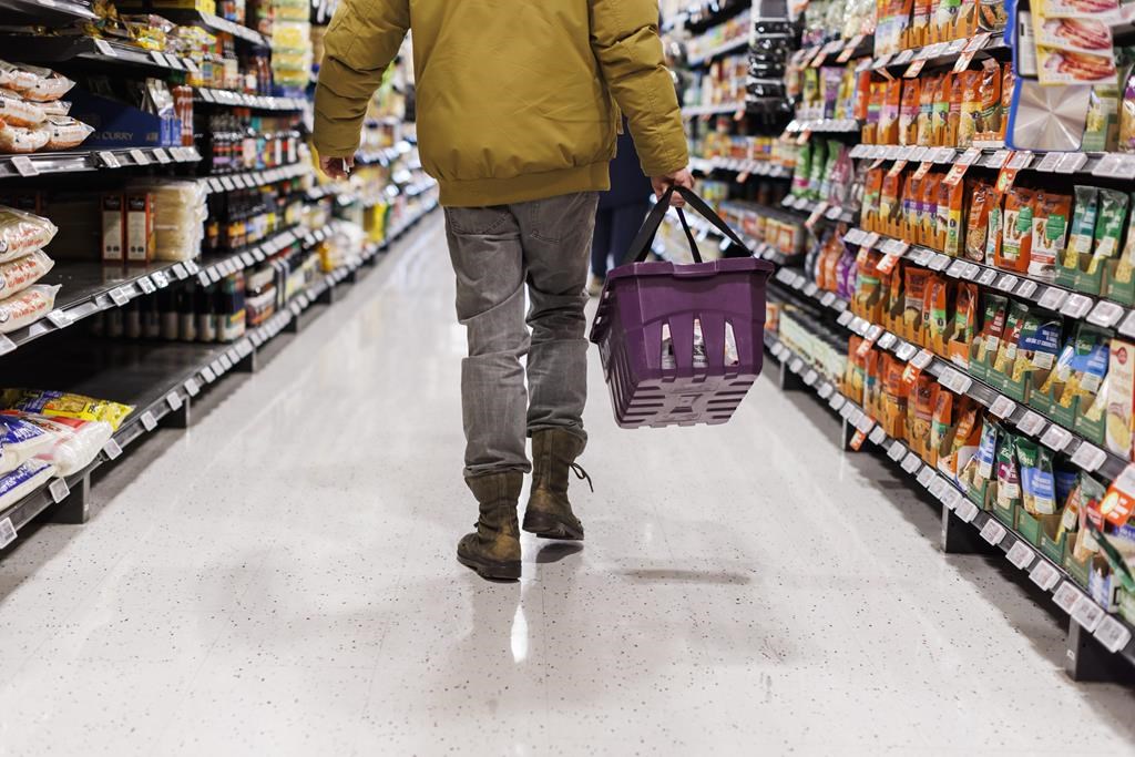 A customer browses an aisle at a grocery store In Toronto on Friday, Feb. 2, 2024. A labour expert says Unifor has achieved an &quot;important victory&quot; after grocery workers at 11 Dominion stores 