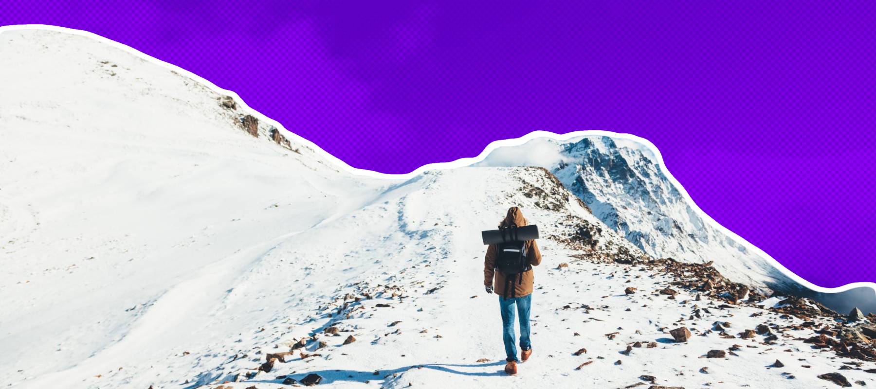 Man with backpack trekking in mountains. Cold weather, snow on hills. Winter hiking.