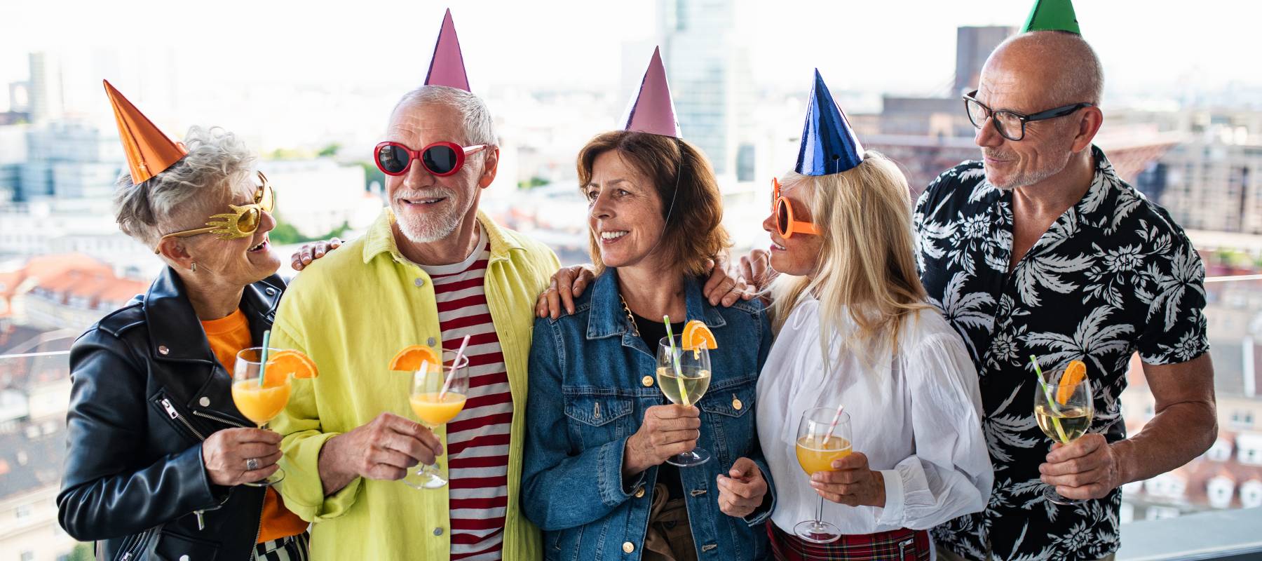 A group of older friends celebrate a birthday.