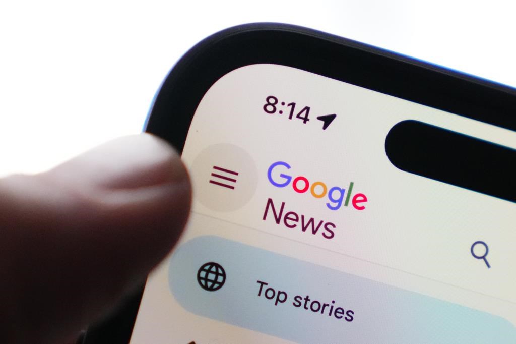 The Google News homepage is displayed on an iPhone in Ottawa on Tuesday, Feb. 28, 2023. Google is taking Canada&#039;s broadcasting regulator to court, arguing &quot;significant&quot; revenues it earns from
