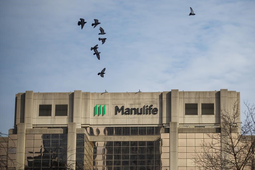 Signage is seen on Manulife Financial Corp.&#039;s office tower in Toronto, Tuesday, Feb. 11, 2020. Manulife Financial Corp. says it expects to ramp up its share buyback program this year as it sh