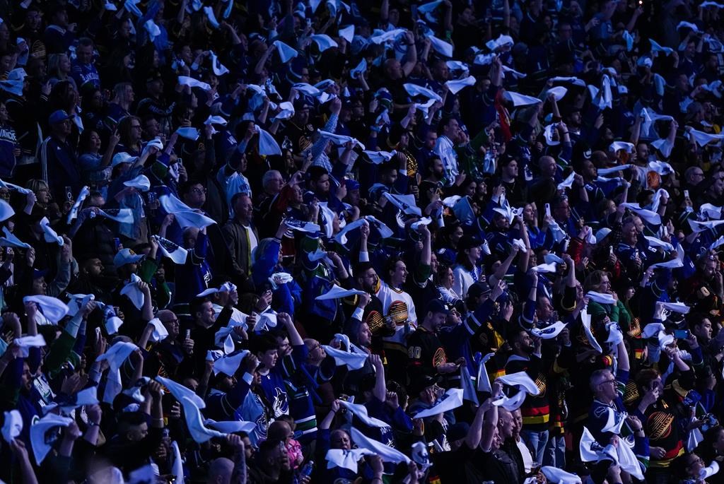 Fans wave towels before the Vancouver Canucks and Nashville Predators play Game 2 of an NHL hockey Stanley Cup first-round playoff series, in Vancouver, on Tuesday, April 23, 2024. 