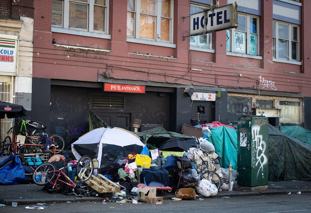 Tents line the sidewalk on East Hastings Street in the Downtown Eastside of Vancouver, on Thursday, July 28, 2022. 