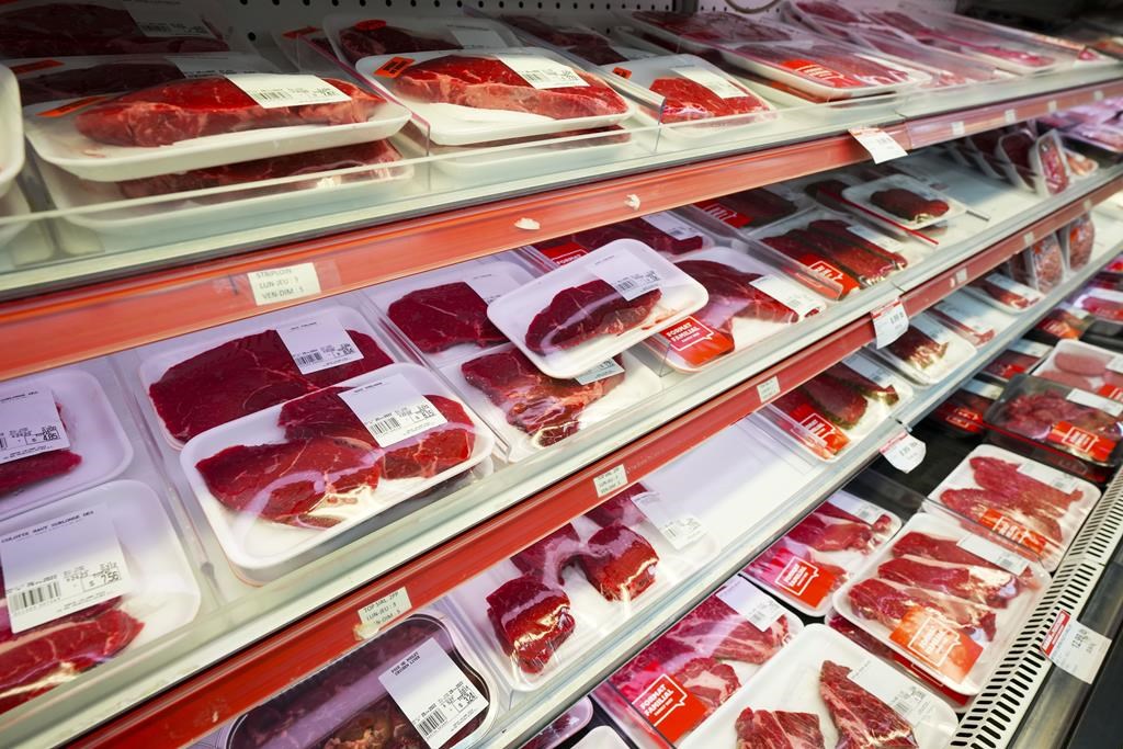 Statistics Canada says food prices drove inflation lower in April, with the cost of groceries rising 1.4 per cent compared with a year ago. Beef and meat products are displayed for sale at a 