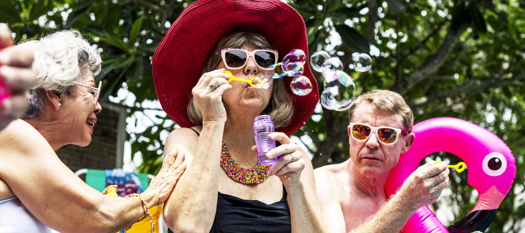 A group of older people celebrating.