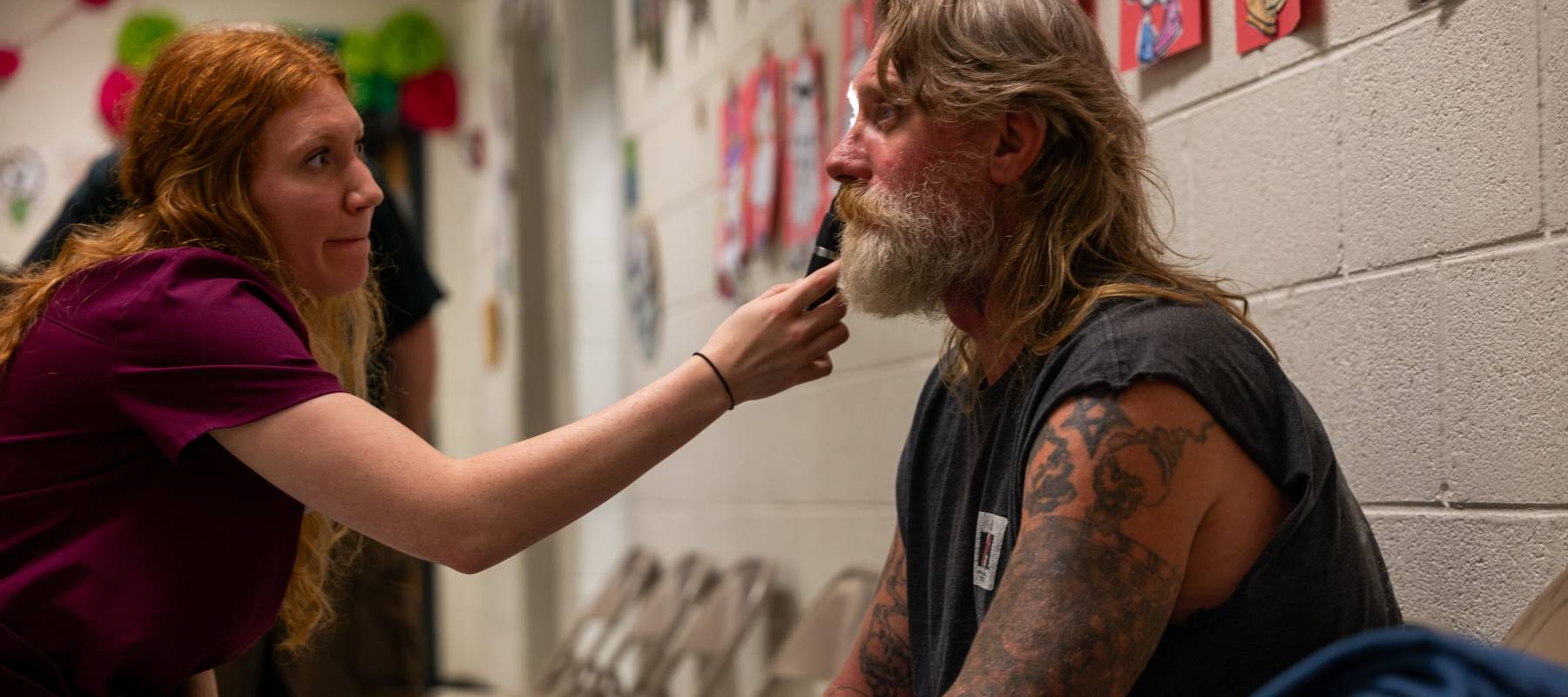 Optometry student administers vision tests to a patient.