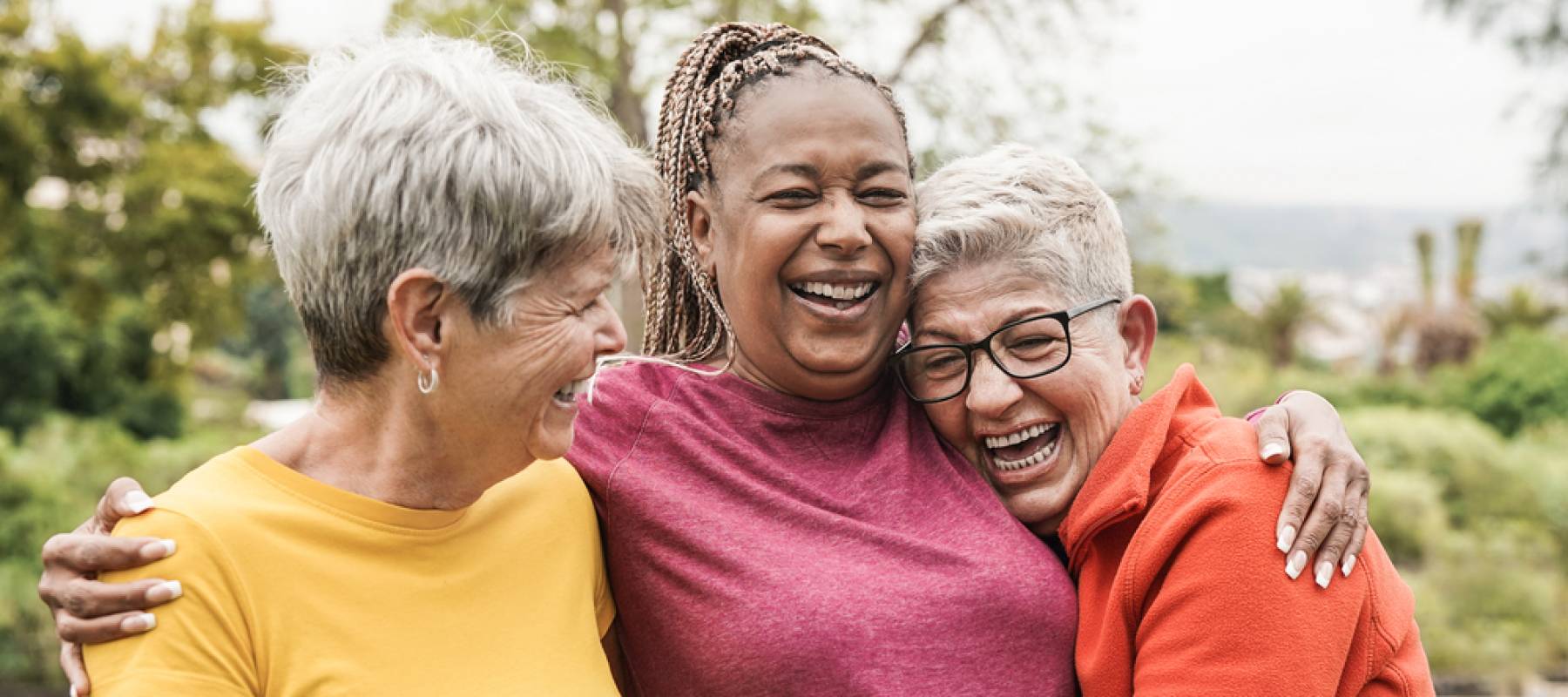 Happy multiracial senior women having fun together outdoor