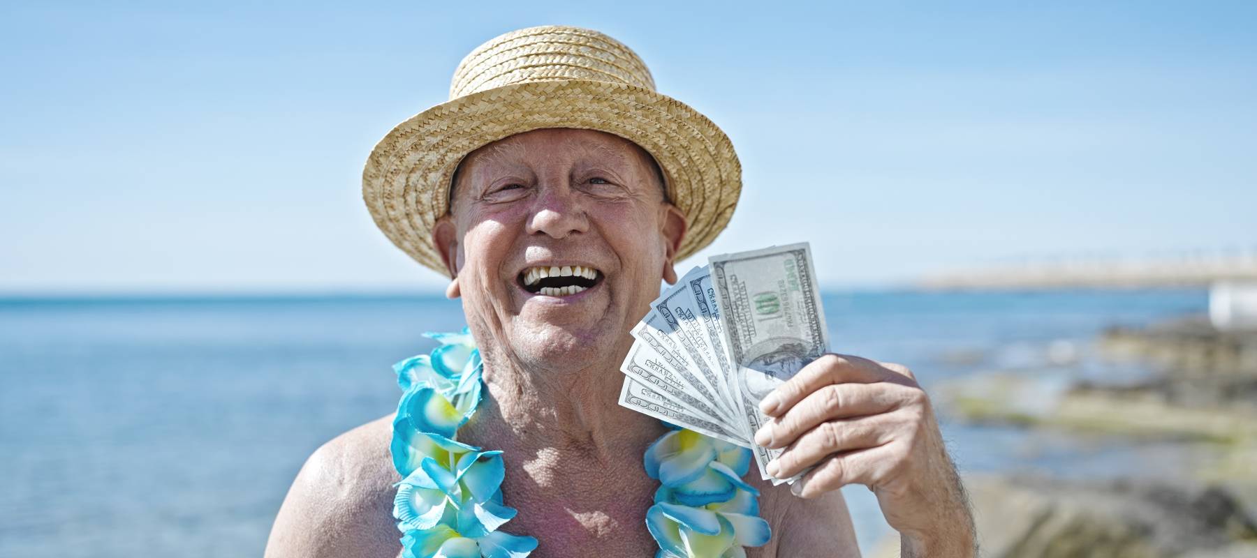 Older man with handful of cash.