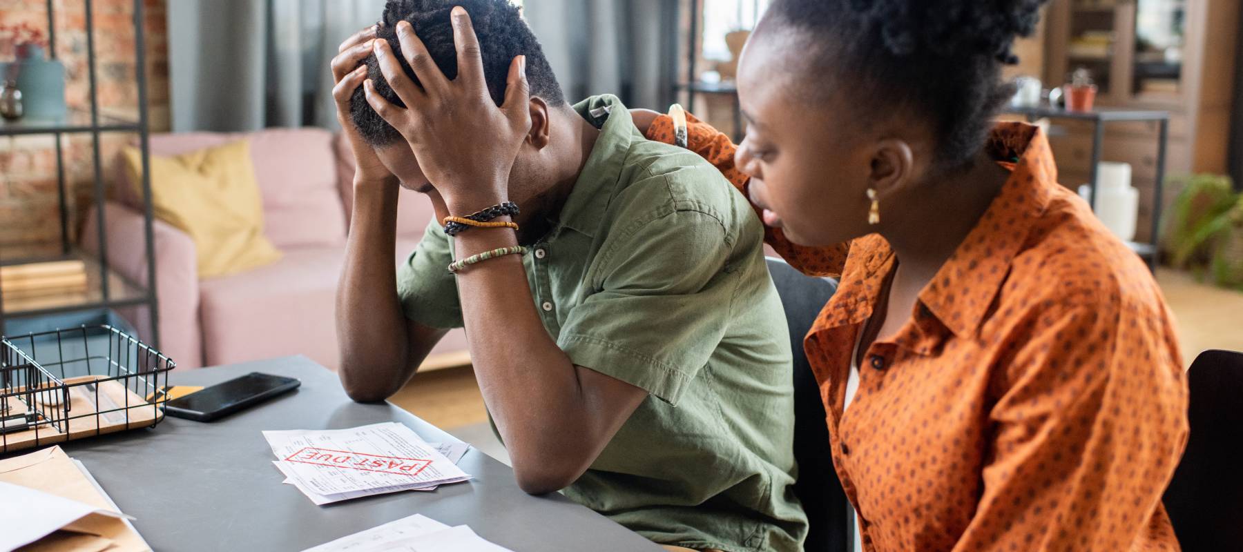 A young couple stresses over their finances.