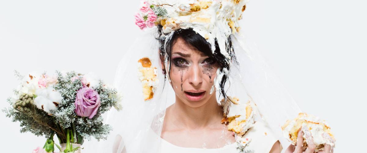 angry bride with cake on head