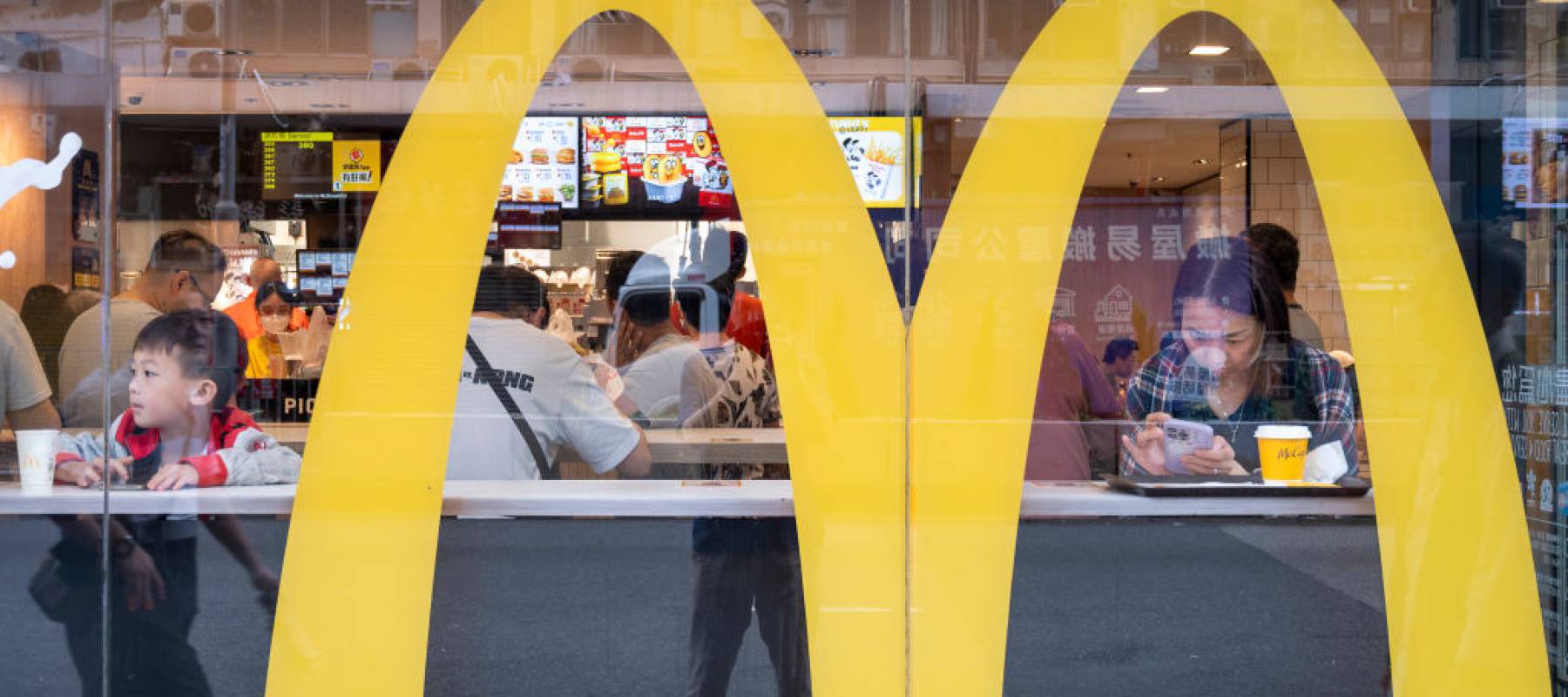 Customers seen eating at a McDonalds counter.
