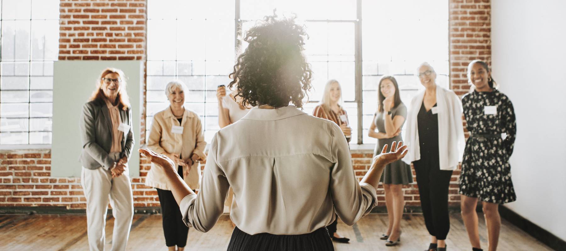 A woman holds court with a group of people