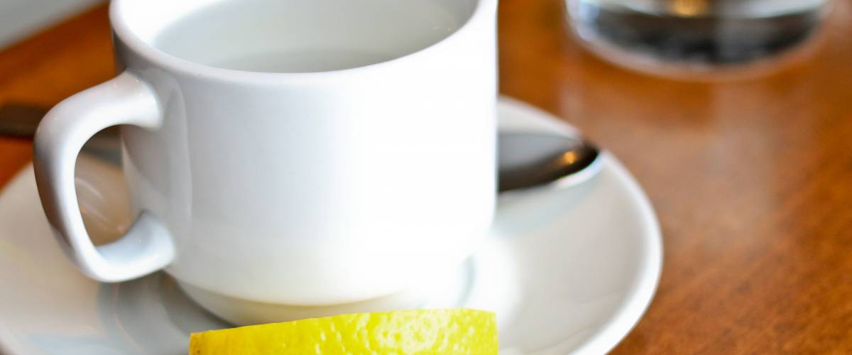 Teacup with lemon wedge