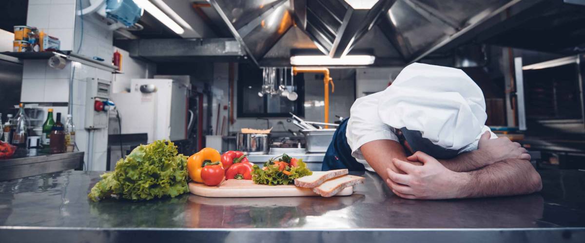 Tired chef working in the kitchen