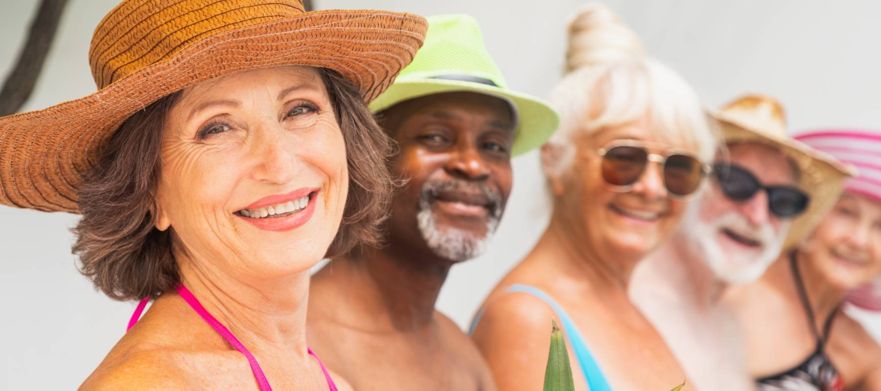A group of old friends enjoy a swimming pool.