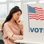 Young voter voting at polling station