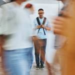sad university student, black man and mental health problems in busy college