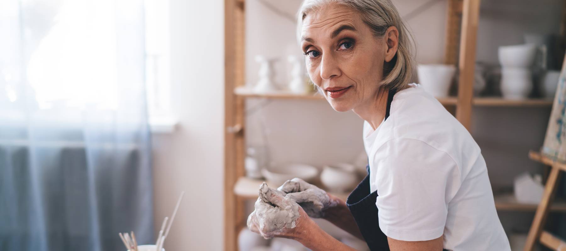 A woman making pottery.
