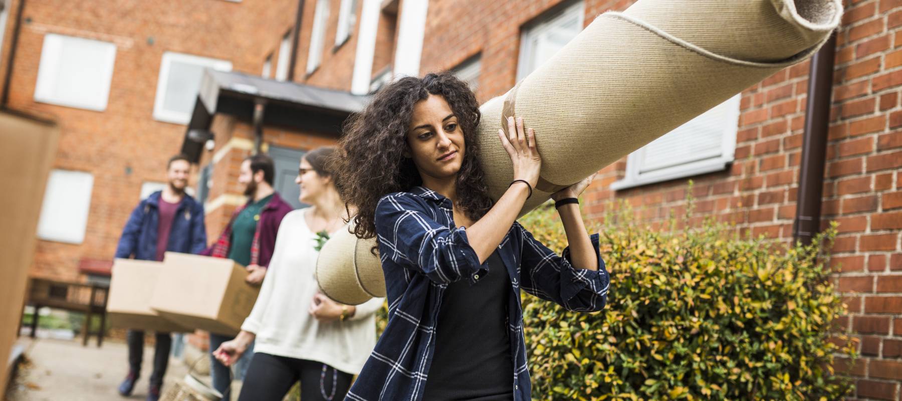 A group of young people move house.