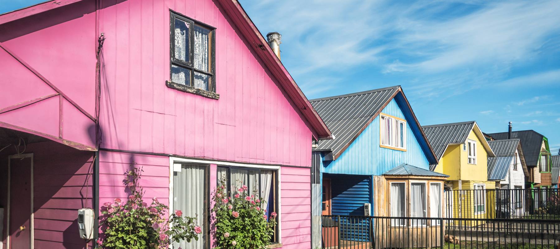A row of brightly colored houses.