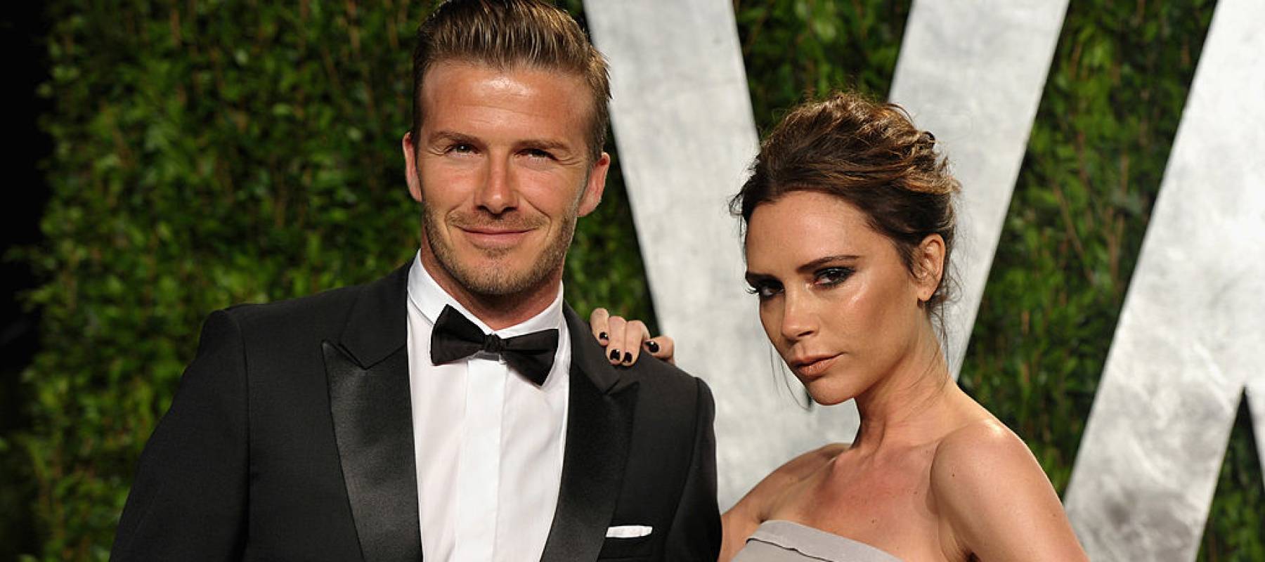 Athlete David Beckham and fashion designer Victoria Beckham arrive at the 2012 Vanity Fair Oscar Party