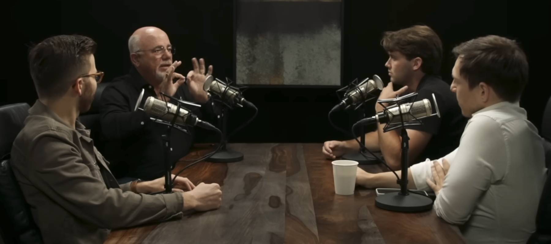 Dave Ramsey (back left) speaks during an appearance on "The Iced Coffee Hour" podcast.