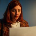 Young female worried about the cost of the bill.