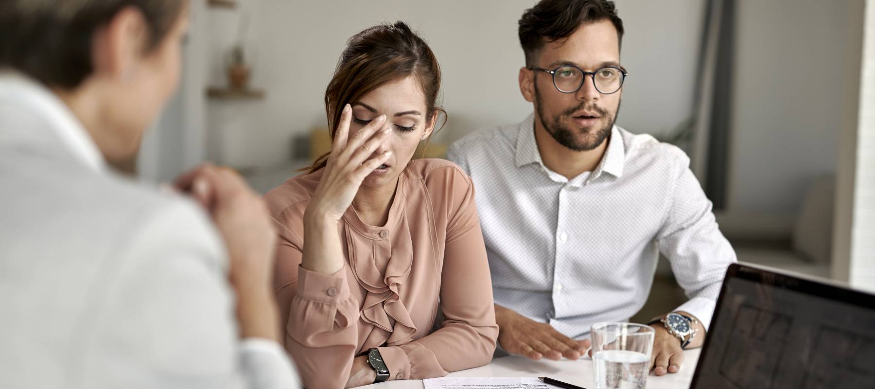 A couple are baffled during a discussion with an expert.