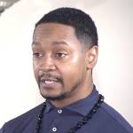 Close up of man speaking to the camera.