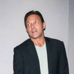Jordan Belfort rolling his eyes and looking to the side, taken by surprise.
