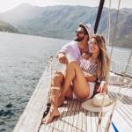 loving Caucasian couple spending happy time on a yacht at sea