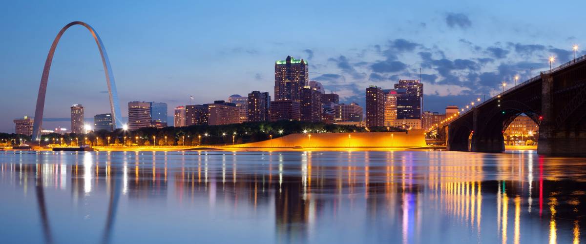 City of St. Louis skyline. Panoramic image of St. Louis downtown with Gateway Arch at twilight.