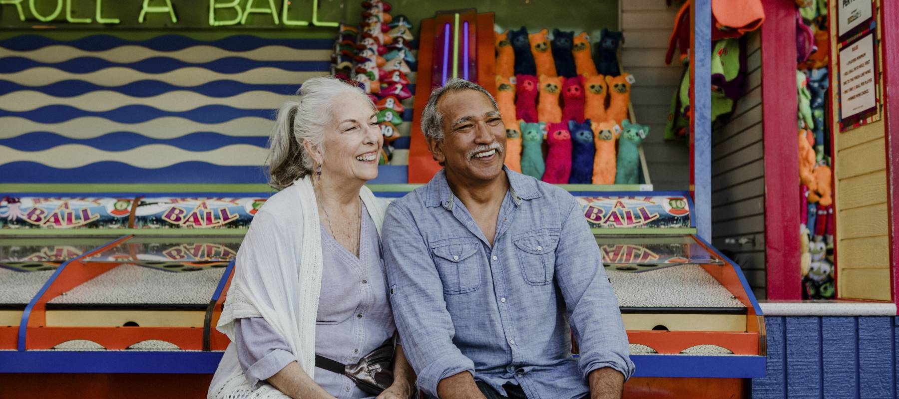 Seniors smiling at a fair