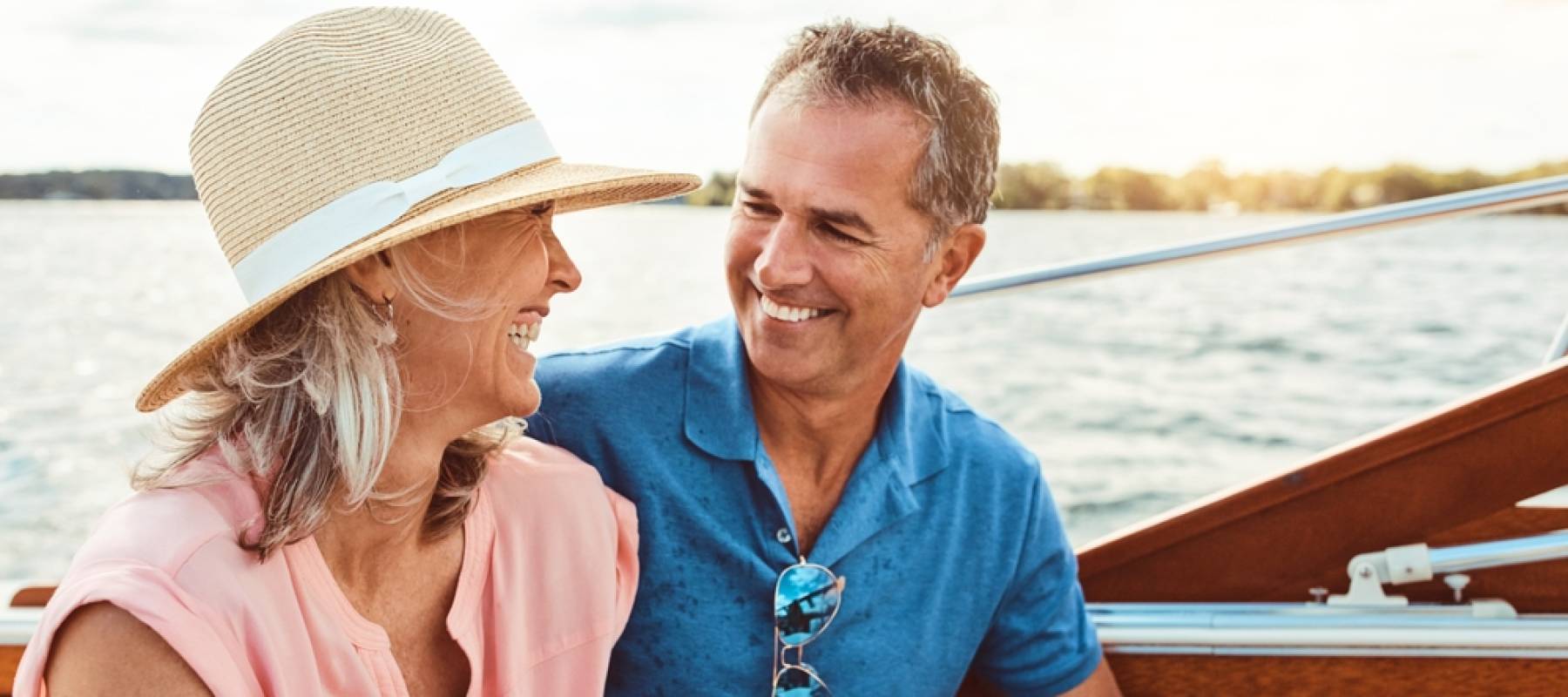 Happy couple, ocean adventure and together in boat on holiday,