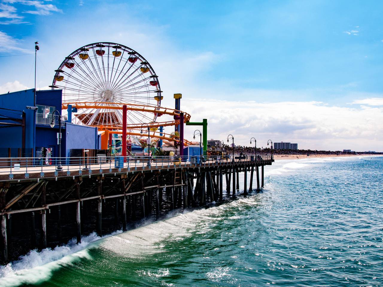 The Santa Monica Pier is a large double-jointed pier at the foot of Colorado Avenue in Santa Monica, California.